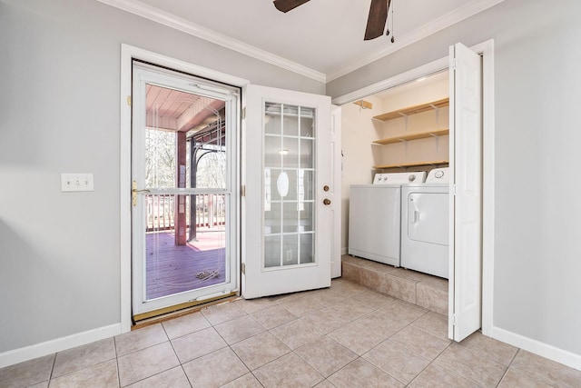 entryway with separate washer and dryer, ornamental molding, ceiling fan, and light tile patterned flooring