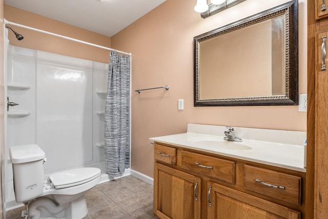 bathroom featuring vanity, toilet, curtained shower, and tile patterned flooring