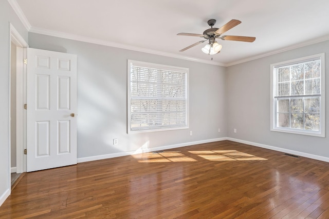 spare room with hardwood / wood-style flooring, ceiling fan, and crown molding