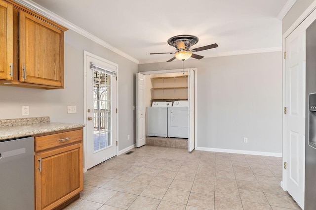 kitchen featuring crown molding, separate washer and dryer, dishwasher, and light tile patterned floors