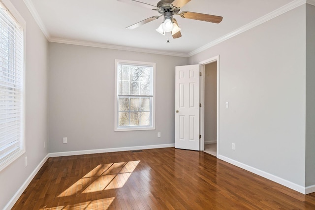 unfurnished room featuring dark hardwood / wood-style flooring, crown molding, and ceiling fan