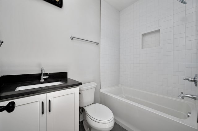 full bathroom with vanity, tiled shower / bath, and toilet