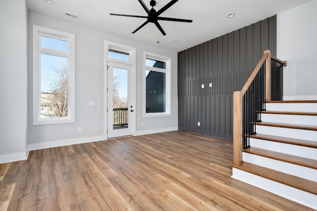 entrance foyer with ceiling fan and light hardwood / wood-style floors