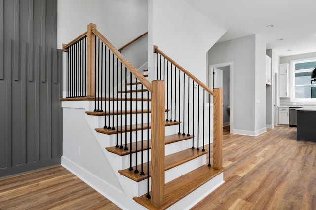 stairs with wood-type flooring