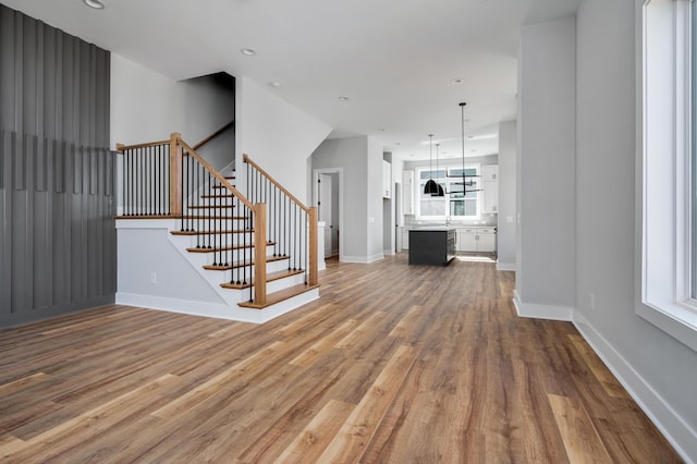 unfurnished living room featuring hardwood / wood-style floors