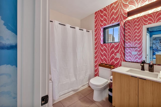 full bathroom with vanity, shower / bathtub combination with curtain, tile patterned floors, and toilet