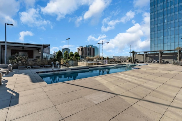 view of swimming pool with a patio