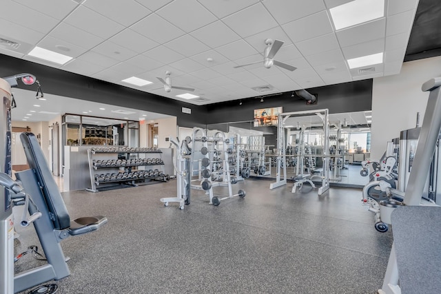 exercise room featuring a paneled ceiling