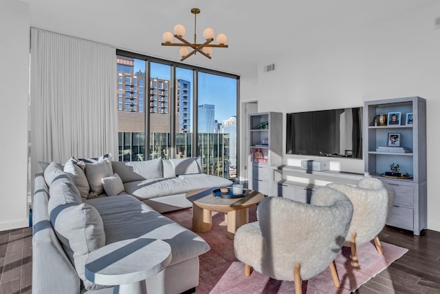 living room featuring expansive windows, dark hardwood / wood-style floors, and a chandelier