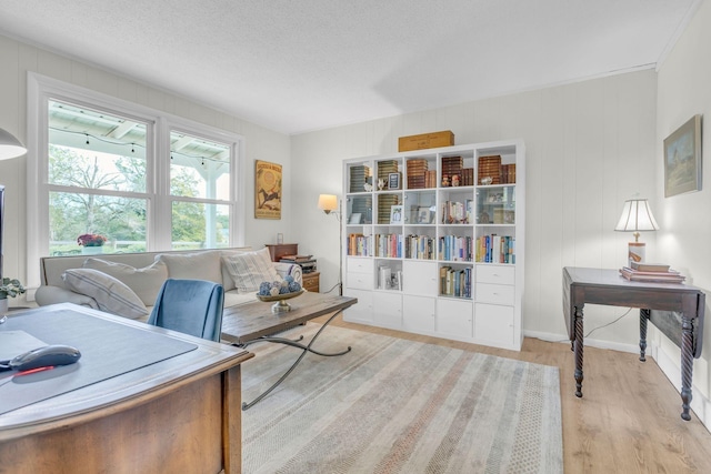 office featuring a textured ceiling and light hardwood / wood-style floors