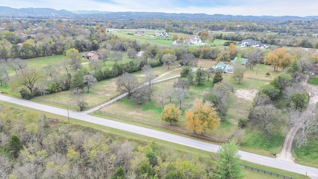 bird's eye view featuring a mountain view and a rural view