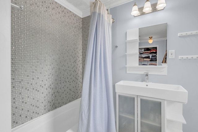 bathroom with ornamental molding, shower / bath combination with curtain, and vanity