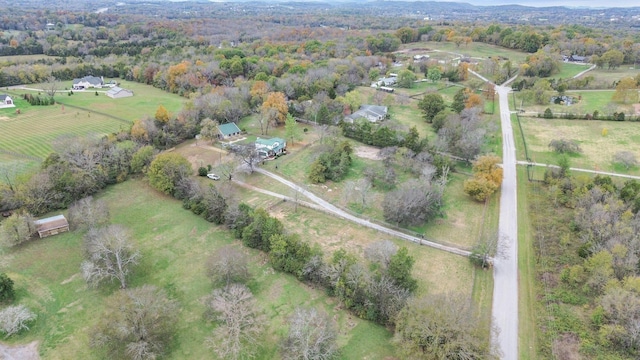 birds eye view of property with a rural view