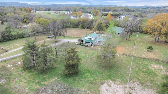 drone / aerial view featuring a mountain view and a rural view