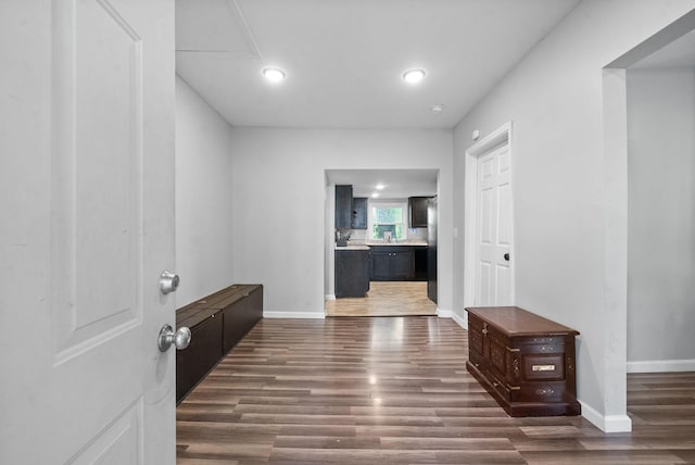 hall featuring dark wood-type flooring