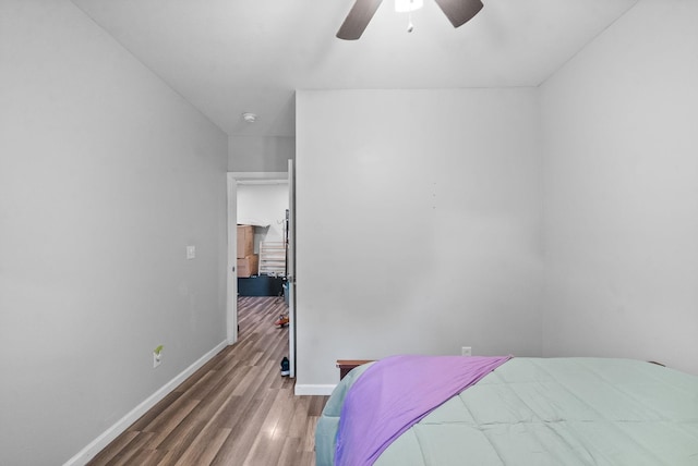 bedroom with hardwood / wood-style floors and ceiling fan