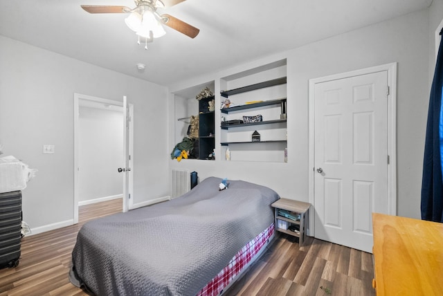 bedroom with dark wood-type flooring and ceiling fan