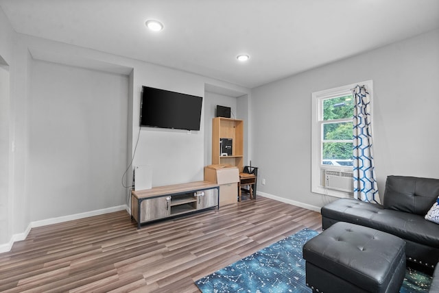 living room featuring wood-type flooring and cooling unit