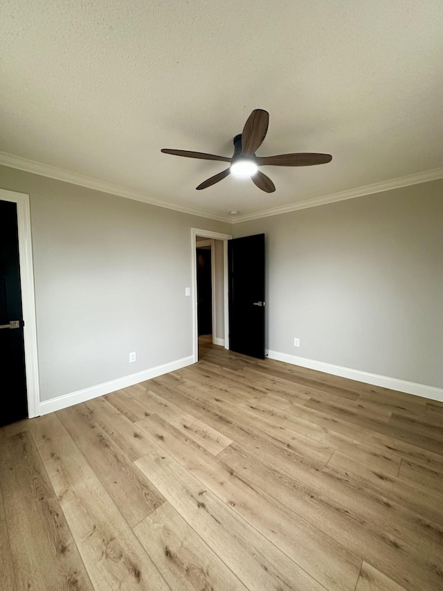 unfurnished bedroom with crown molding, a textured ceiling, and light hardwood / wood-style floors