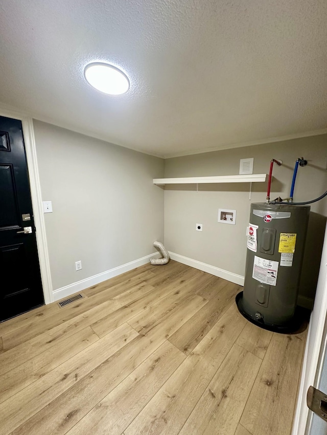 clothes washing area featuring electric water heater, washer hookup, wood-type flooring, a textured ceiling, and hookup for an electric dryer