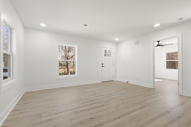 unfurnished room with light hardwood / wood-style flooring