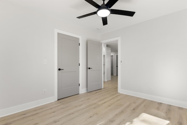 unfurnished bedroom featuring ceiling fan and light wood-type flooring