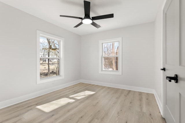 empty room featuring light hardwood / wood-style flooring and ceiling fan