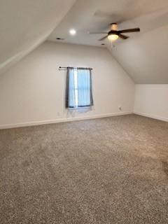 additional living space with vaulted ceiling, carpet floors, and ceiling fan