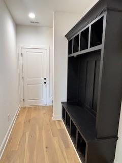 mudroom with light wood-type flooring