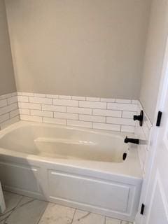 bathroom featuring a washtub