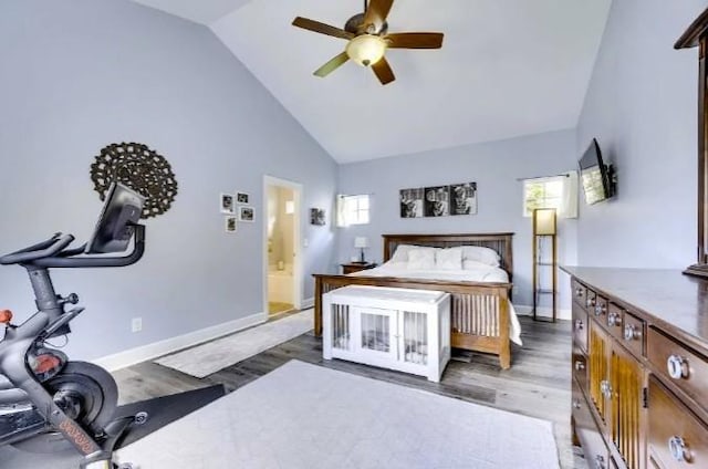 bedroom with dark wood-type flooring, ceiling fan, high vaulted ceiling, and multiple windows