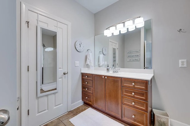 bathroom with vanity and tile patterned flooring