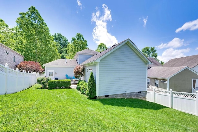 rear view of property with a yard