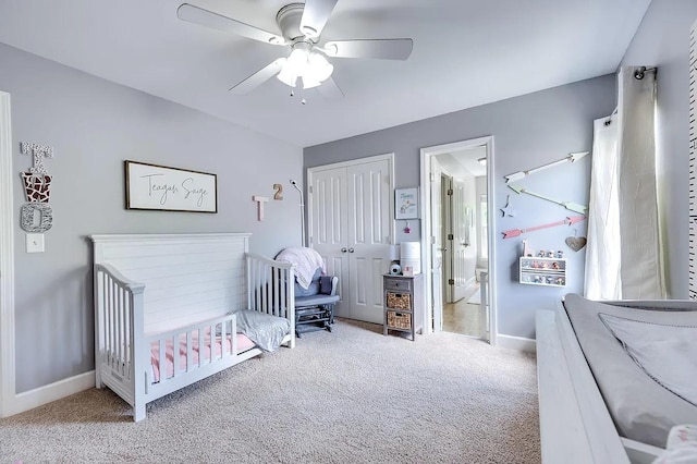 bedroom featuring ceiling fan, connected bathroom, carpet flooring, and a closet