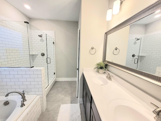 bathroom with independent shower and bath, vanity, and tile patterned flooring