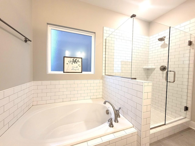 bathroom with tile patterned flooring and plus walk in shower