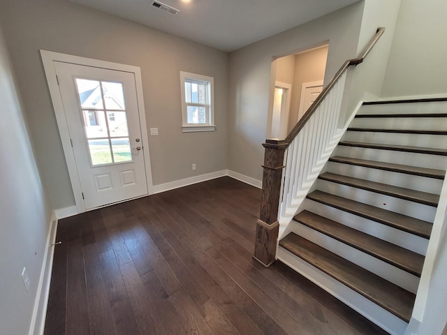 entrance foyer featuring dark wood-type flooring