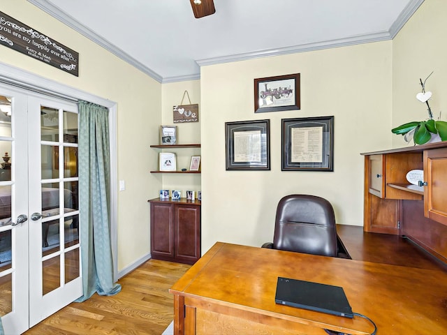 home office with ornamental molding, light hardwood / wood-style floors, and french doors