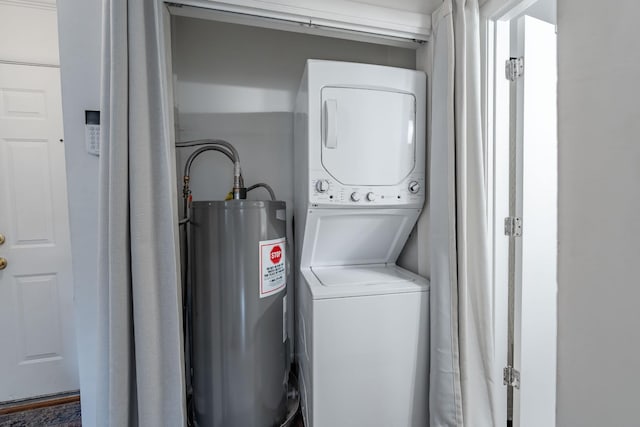 clothes washing area with water heater and stacked washing maching and dryer