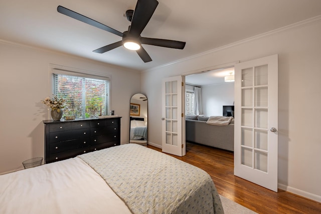 bedroom with multiple windows, crown molding, dark hardwood / wood-style flooring, and french doors