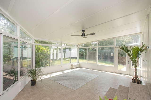 unfurnished sunroom featuring ceiling fan