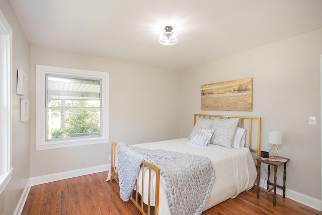 bedroom with wood-type flooring