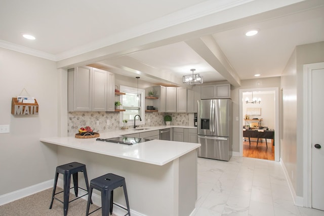 kitchen with stainless steel appliances, sink, gray cabinetry, and kitchen peninsula