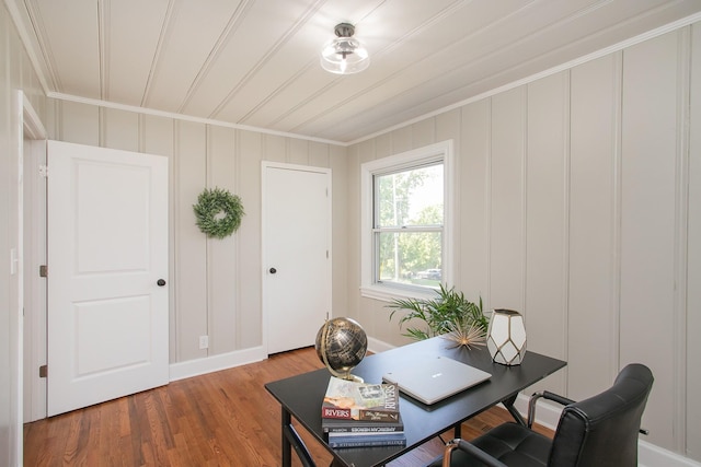 home office featuring wood-type flooring and ornamental molding