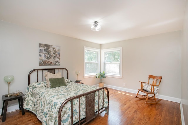 bedroom with wood-type flooring