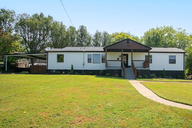 view of front facade with a front lawn and covered porch