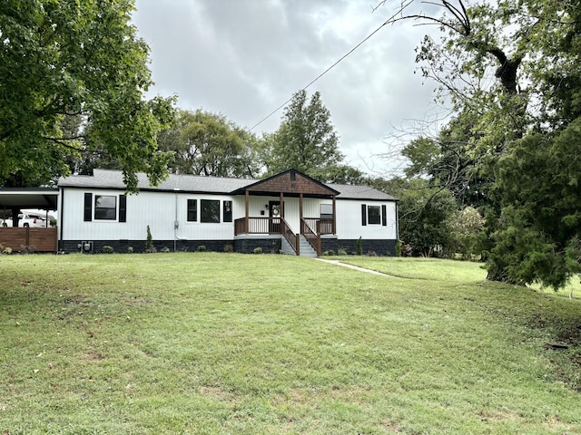 view of front of house featuring covered porch, a front yard, a shingled roof, crawl space, and a carport