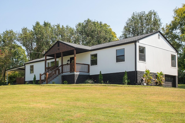 view of front of house featuring an attached garage and a front lawn