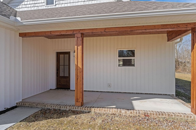 view of exterior entry featuring a patio