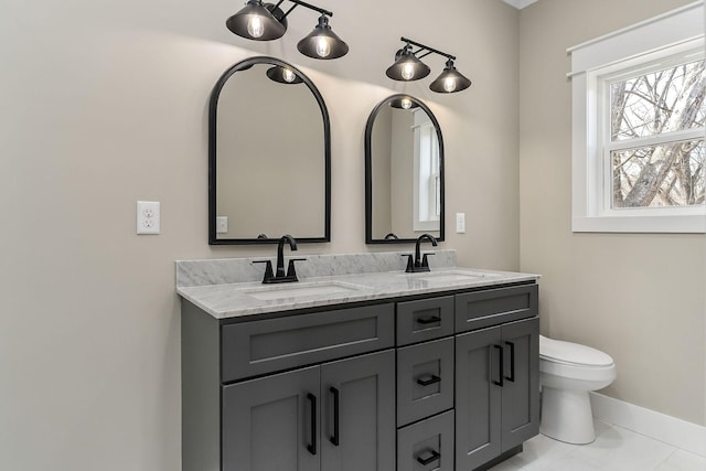 bathroom featuring vanity and toilet